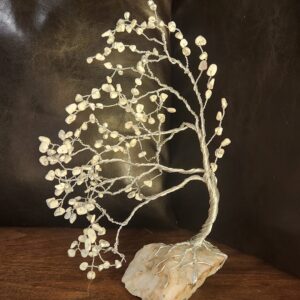Meet my Winter Whisper Tree — a hand-twisted wire art piece adorned with natural white howlite chips and rooted in raw quartz.