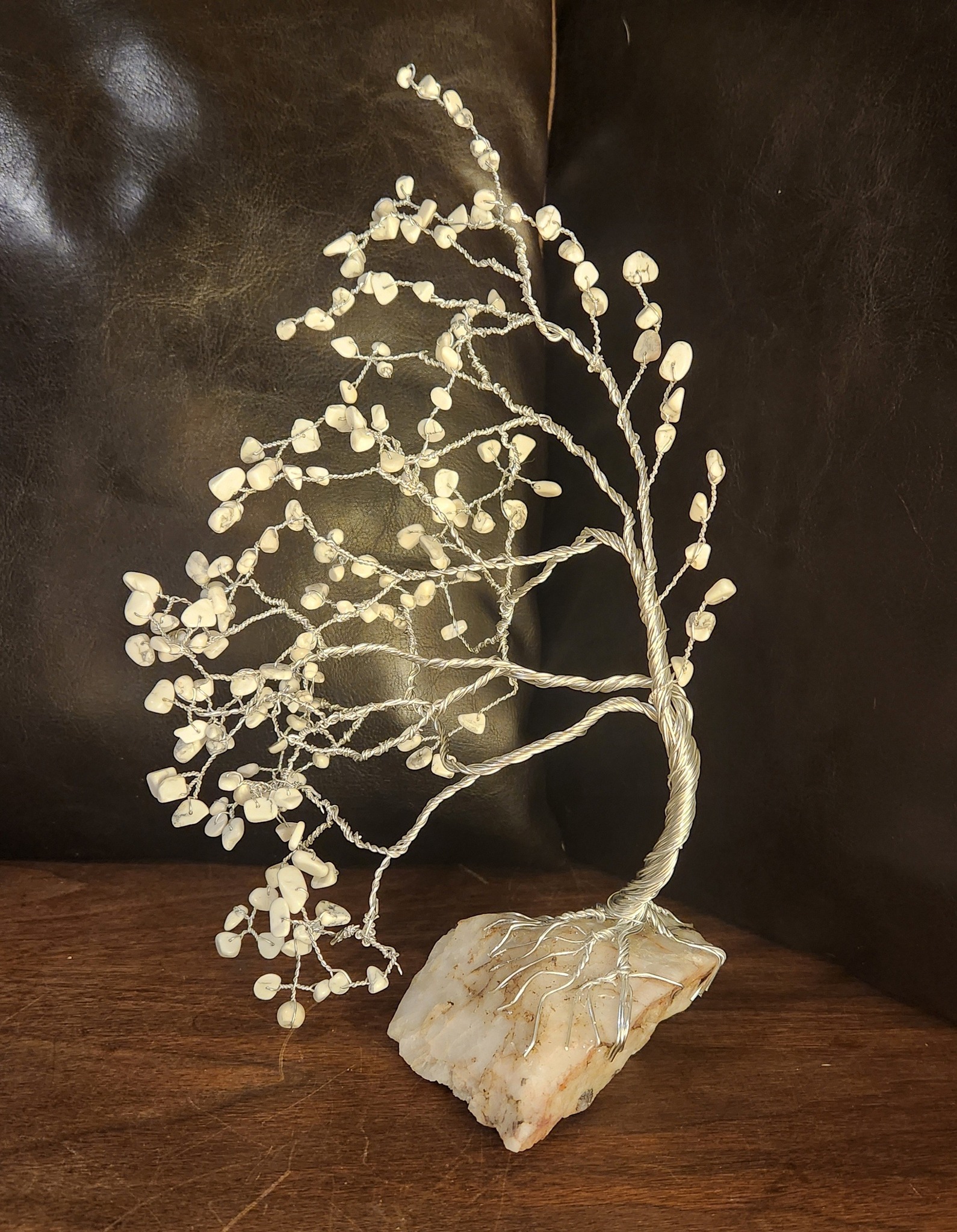 Meet my Winter Whisper Tree — a hand-twisted wire art piece adorned with natural white howlite chips and rooted in raw quartz.